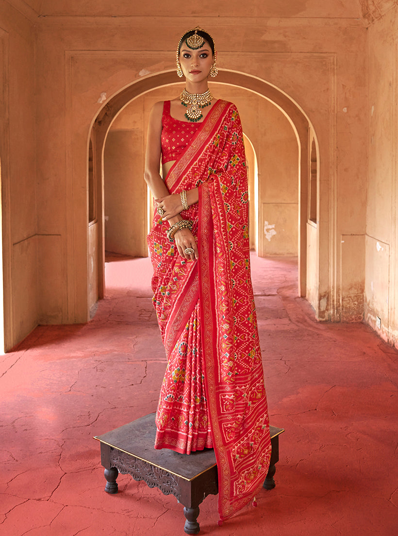 Red silk saree with classic patola print for festivals