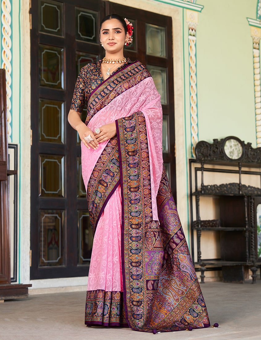 A light pink viscose georgette saree with delicate Lucknowi embroidery and shimmering foil print.