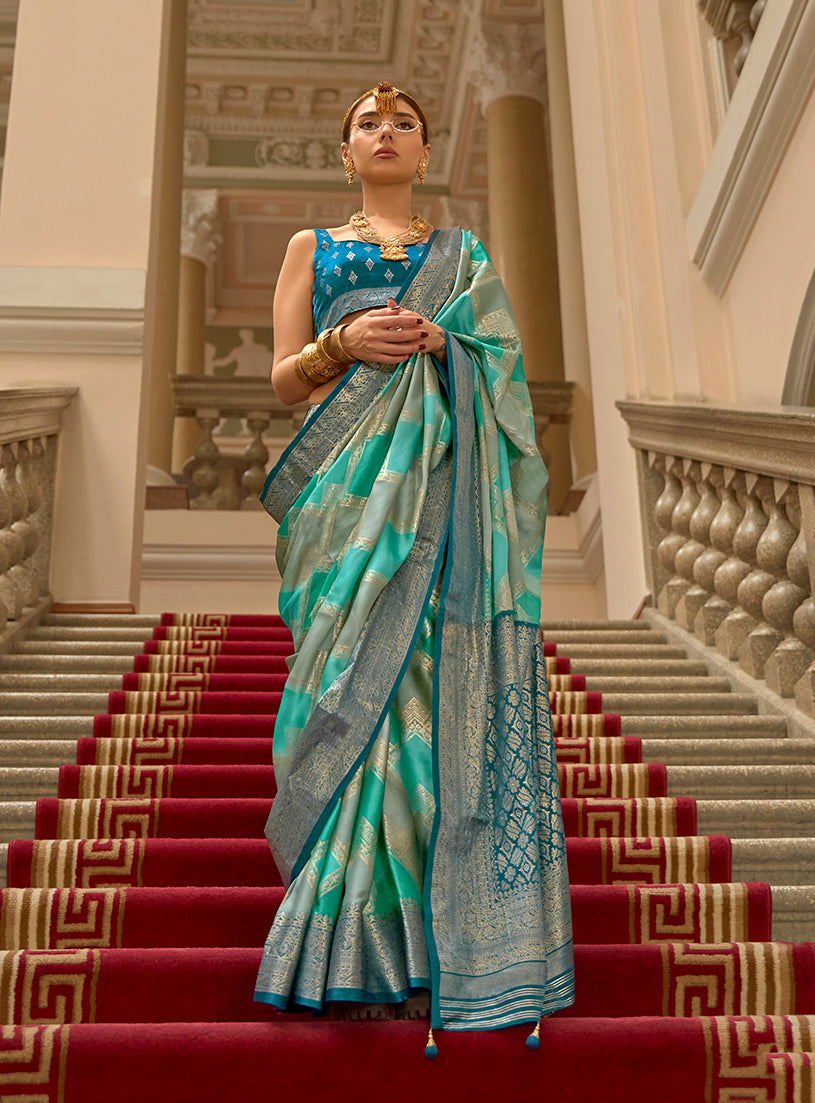 Turquoise satin classic saree with intricate weaving print pattern
