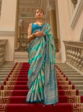 Turquoise satin classic saree with intricate weaving print pattern