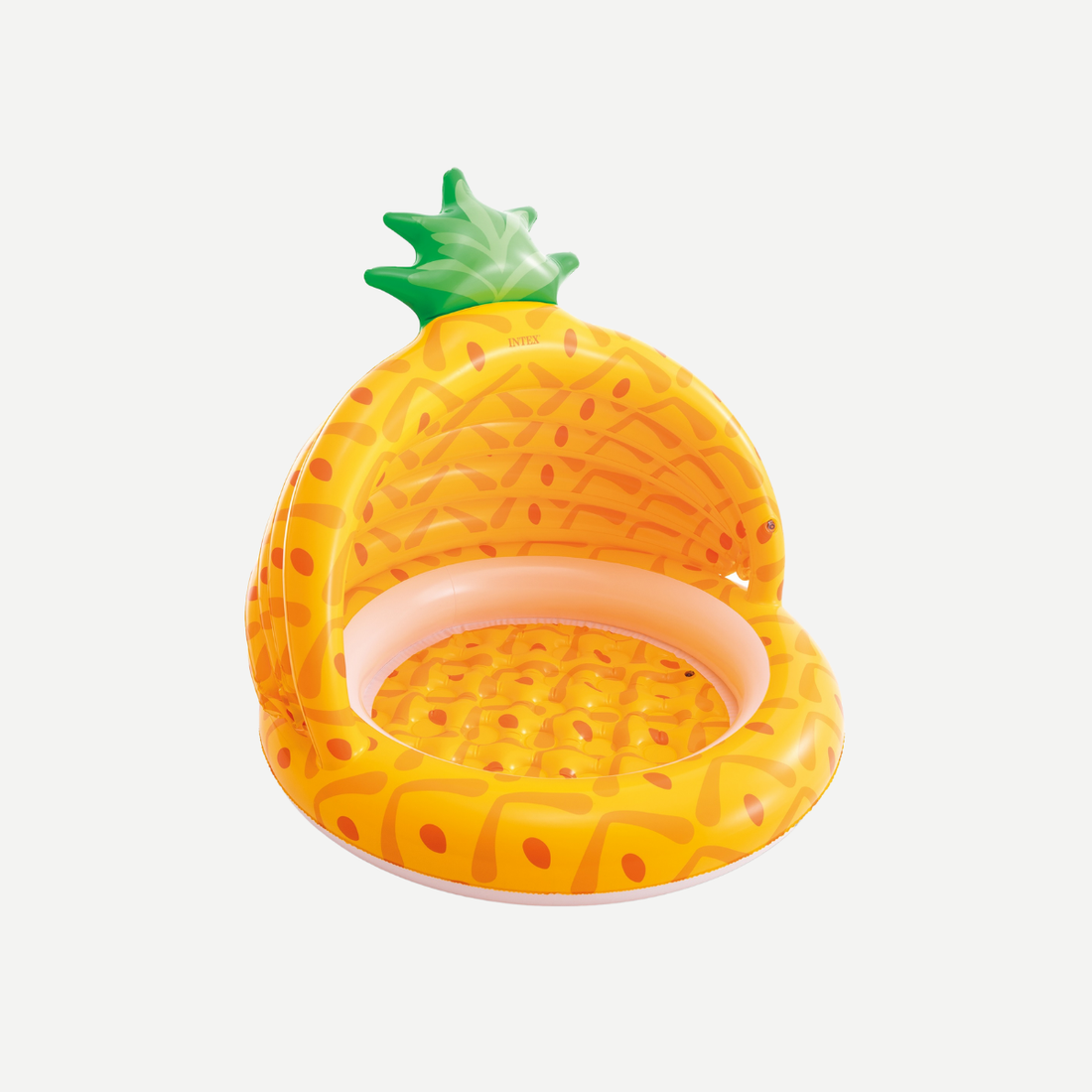 An inflatable pineapple-themed baby pool with a built-in green and yellow sunshade, sitting on a grassy lawn.