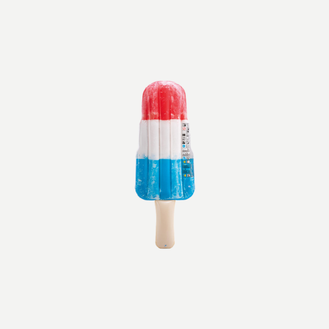 An inflatable red white and blue ice pop shaped pool float against a neutral background.