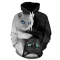 A black and white hooded sweatshirt featuring a large 3D graphic of two cats, one white with blue eyes and one black with green eyes, in a symmetrical design on a white background.