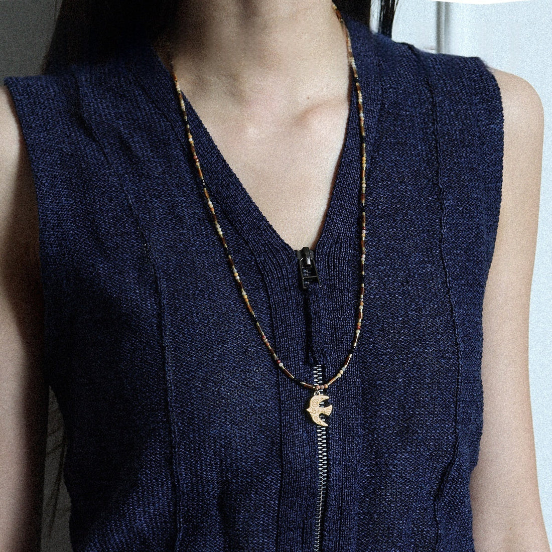 Handmade brass necklace featuring a bird pendant with Tiger's Eye and Crazy Agate stones
