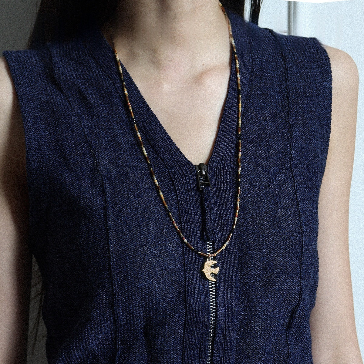 Handmade brass necklace featuring a bird pendant with Tiger's Eye and Crazy Agate stones