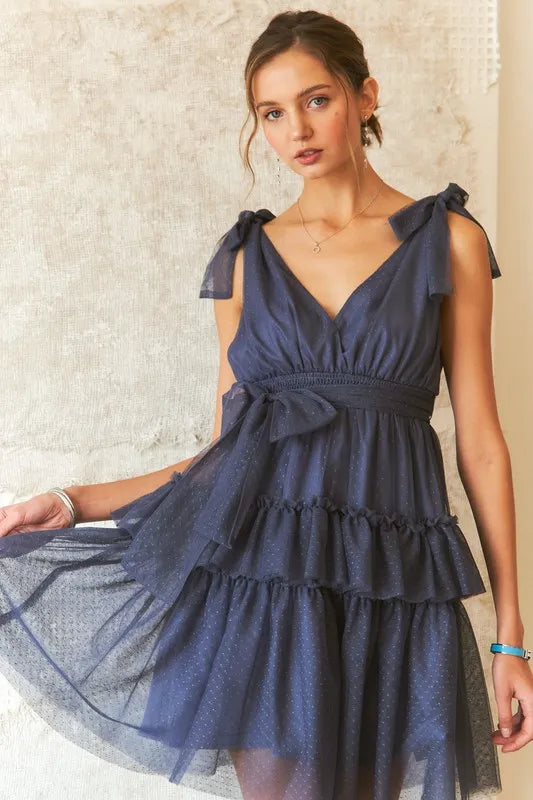 Polka dot mesh dress with adjustable tie shoulders and retro design