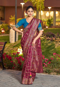 Vibrant dark pink Dola Silk saree with traditional Gharchola pattern and rich pallu