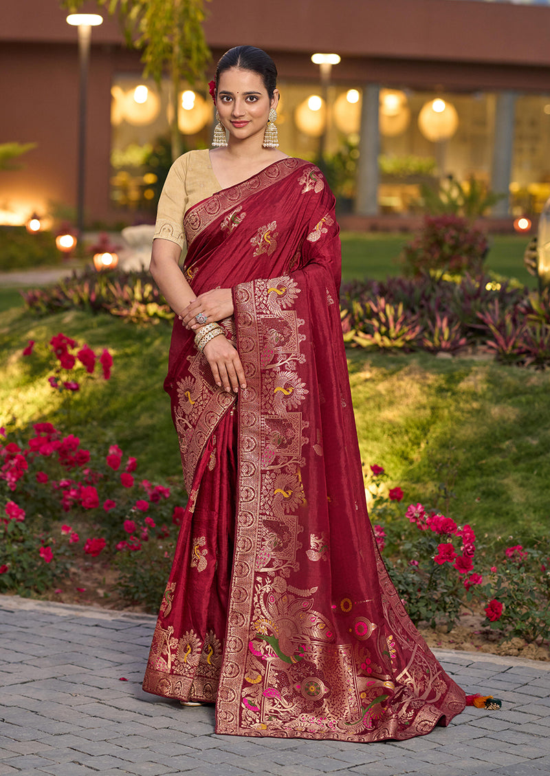 A rich maroon Dola Silk saree with intricate Meenakari woven details