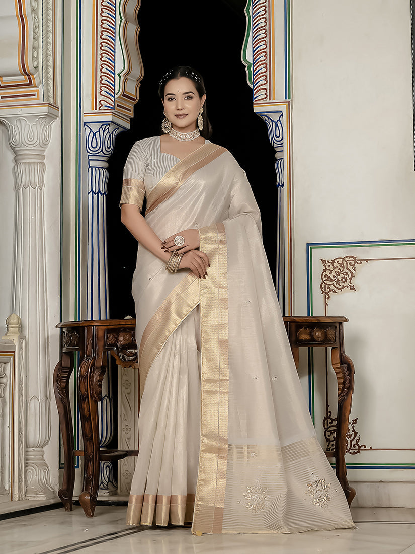 Silver tissue linen designer saree with intricate hand embroidery and matching blouse.