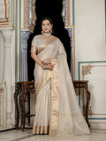 Silver tissue linen designer saree with intricate hand embroidery and matching blouse.