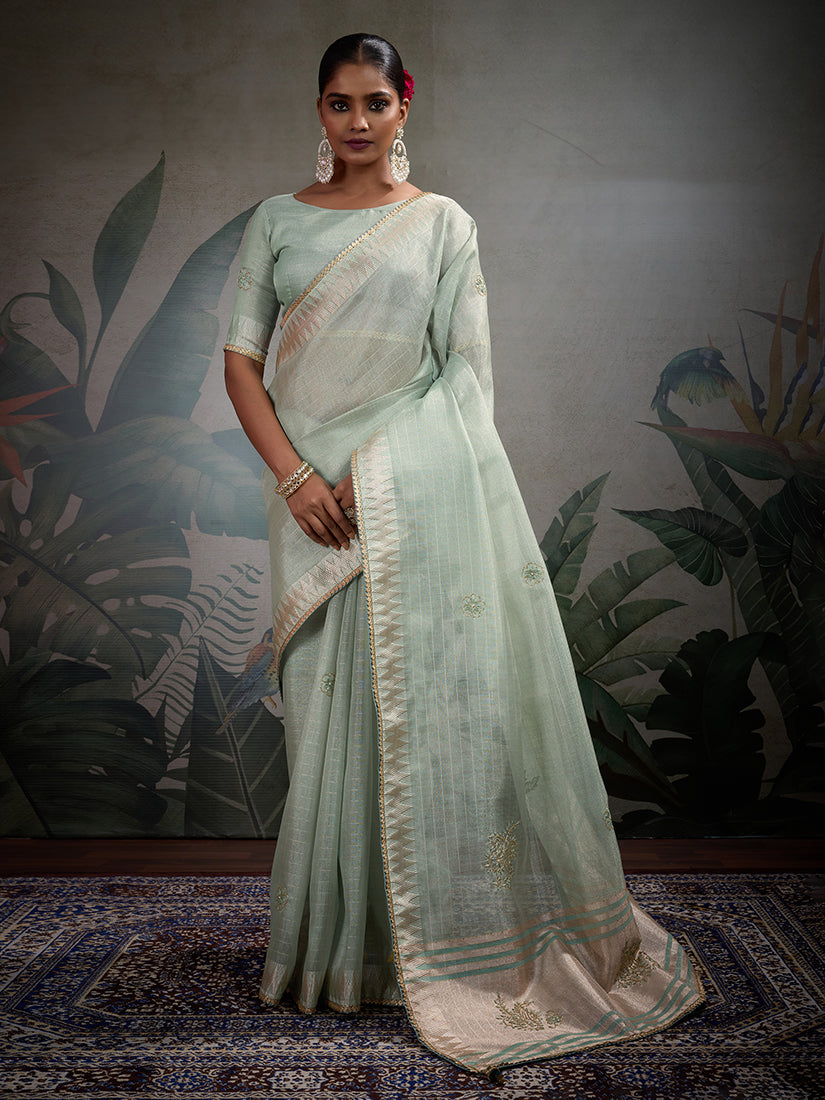 Light blue tissue linen saree featuring intricate Khatli hand work.