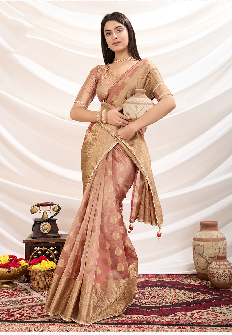 Elegant light peach crush tissue designer saree with matching blouse piece