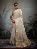 Off white soft tissue silk saree paired with a matching tissue brocade blouse.