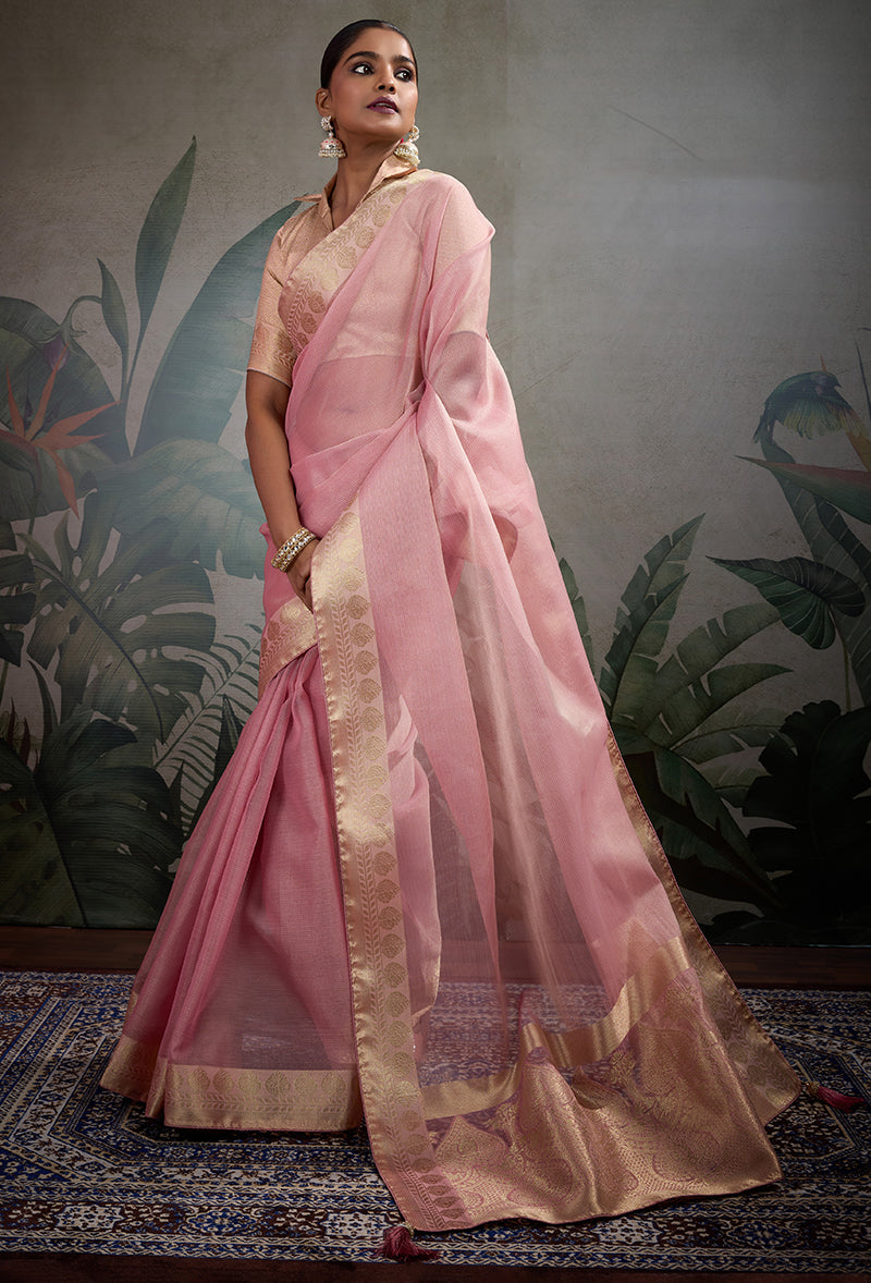Light pink soft tissue silk saree paired with a decorative brocade blouse