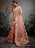 Light peach tissue silk saree featuring intricate brocade blouse fabric
