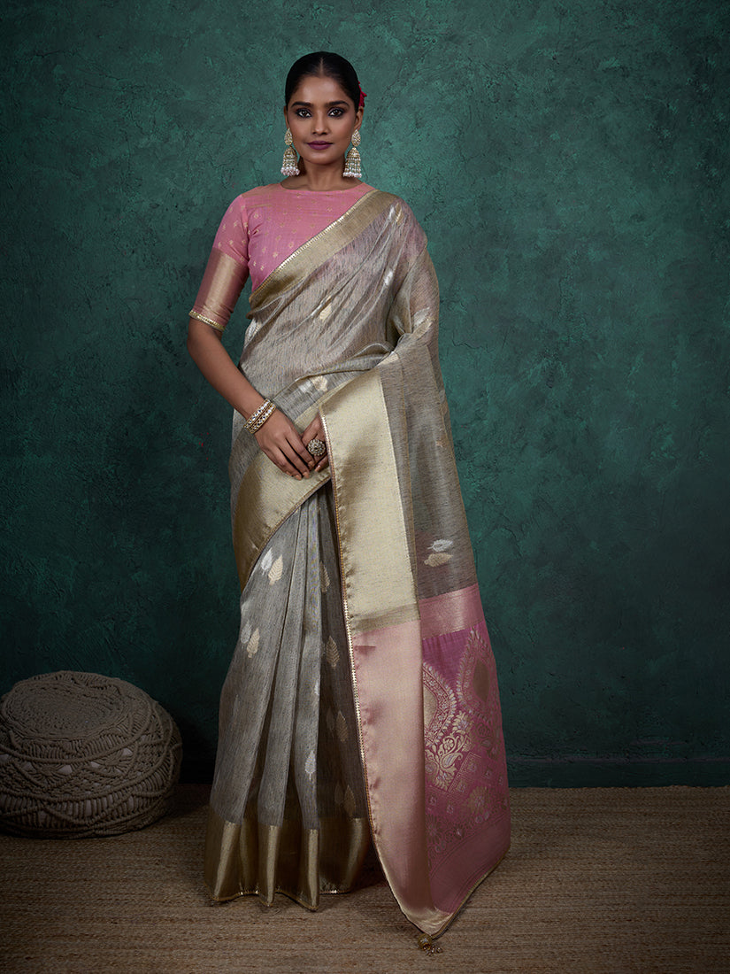 Elegant light grey linen blend saree with woven sequin work and matching blouse piece