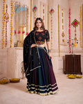 Woman wearing a multi-color viscose cotton Navratri lehenga choli with traditional hand mirror work