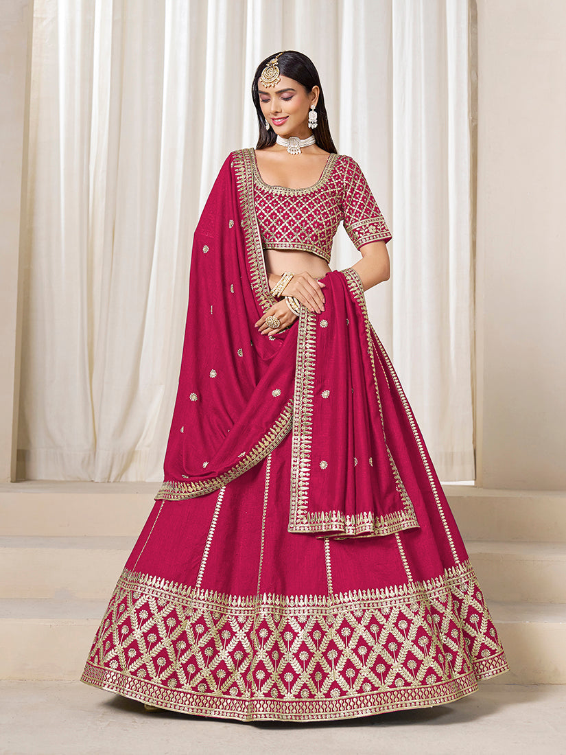 Model wearing a Rani Pink Art Silk A-Line Lehenga Choli set with exquisite embroidery for wedding wear