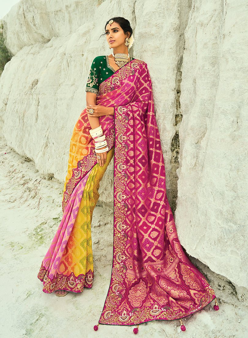 Model wearing a multicolor magenta and yellow silk Bandhej saree with emerald-green accents and embroidery.
