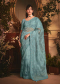 Aqua blue tissue organza saree with all-over butta work and heavy stone border
