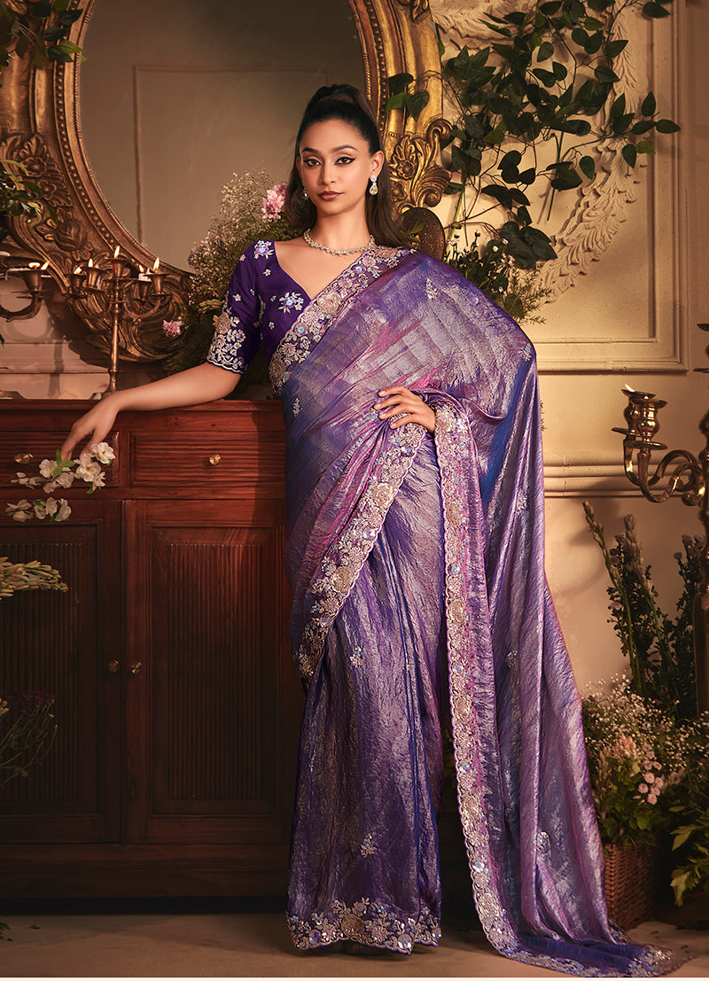 Purple tissue organza saree with all-over butta work and heavy stone-embellished border