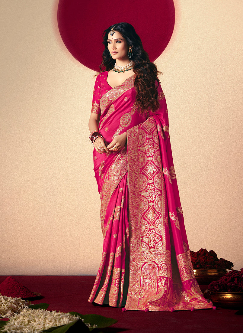 Rani pink viscose silk saree with rich zari weaving and designer tassels.