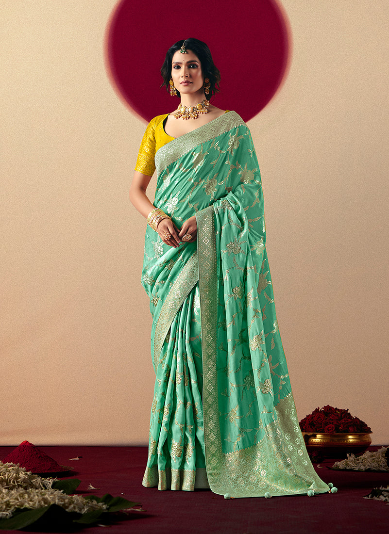 Sea green viscose silk saree featuring detailed zari weaving and designer tassels on the pallu.