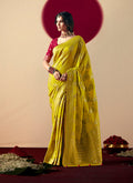 Pear-colored viscose silk saree with intricate gold zari weaving and designer tassels