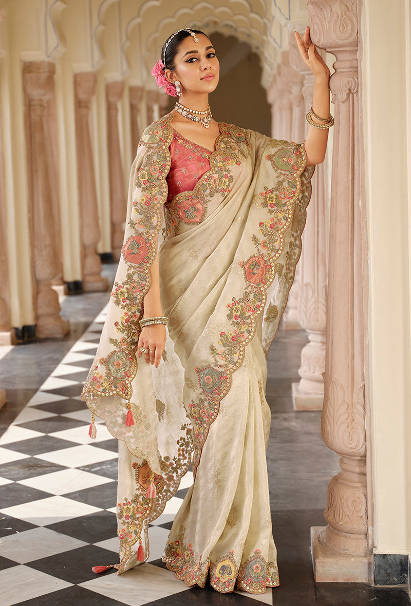Elegant off white silk blend saree featuring beautiful Meenakari zari weaving.