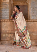Elegant cream silk contemporary saree with ethnic printed patterns