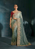 Grey Crepe saree with intricate Cutdana, Moti, and Zarkan hand-embroidered borders.
