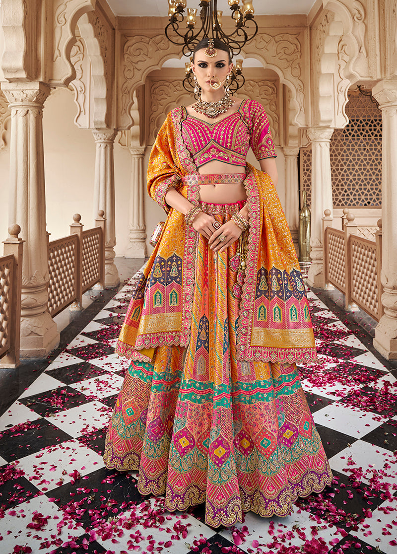 Mustard and Rani Pink Banarasi Silk lehenga with Zarkan and cutwork embroidery