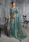 Teal blue tissue saree with detailed Resham and thread embroidery for ceremonial occasions