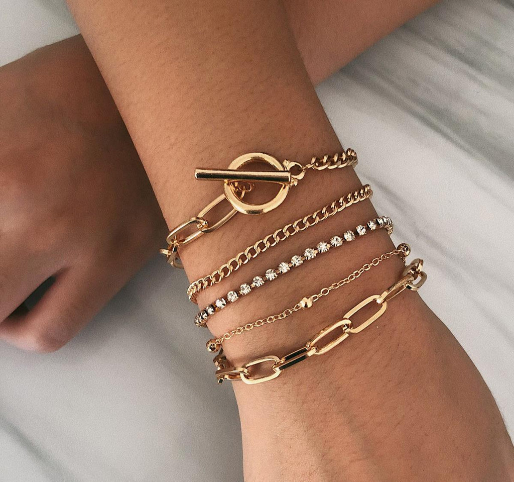 Bohemian multi-layer crystal wrap bracelet with adjustable button closure on a wrist