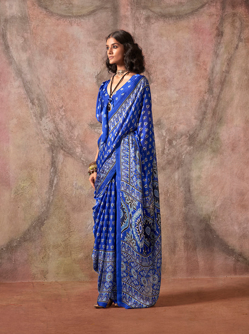 Blue satin georgette saree with traditional Ajrakh and Bandhej print.