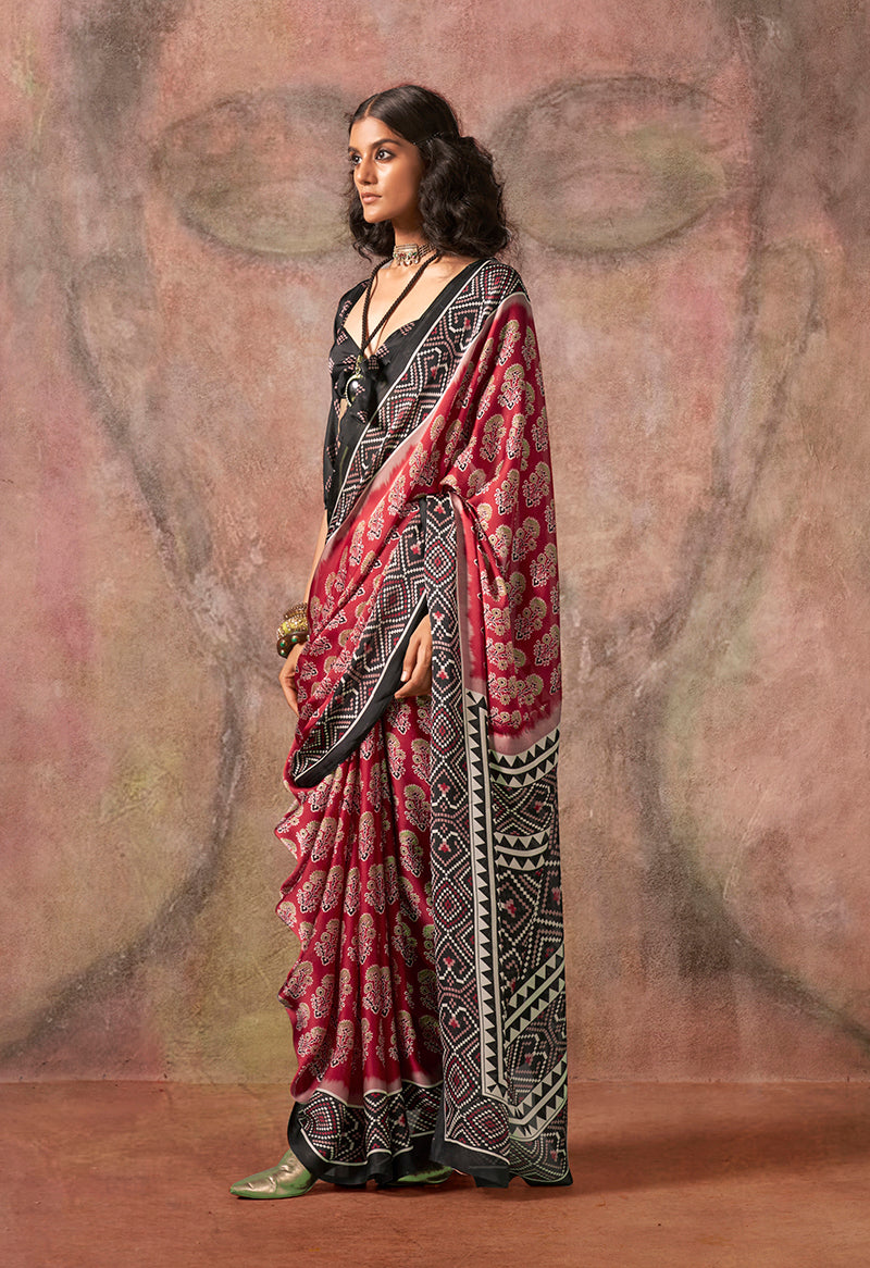 Red and black saree with Ajrakh print and Bandhej pattern in satin georgette
