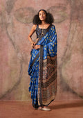 Blue and black satin georgette saree featuring Ajrakh and Bandhej patterns
