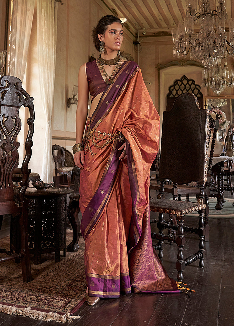 Rust colored Tussar silk saree with intricate traditional weaving work.