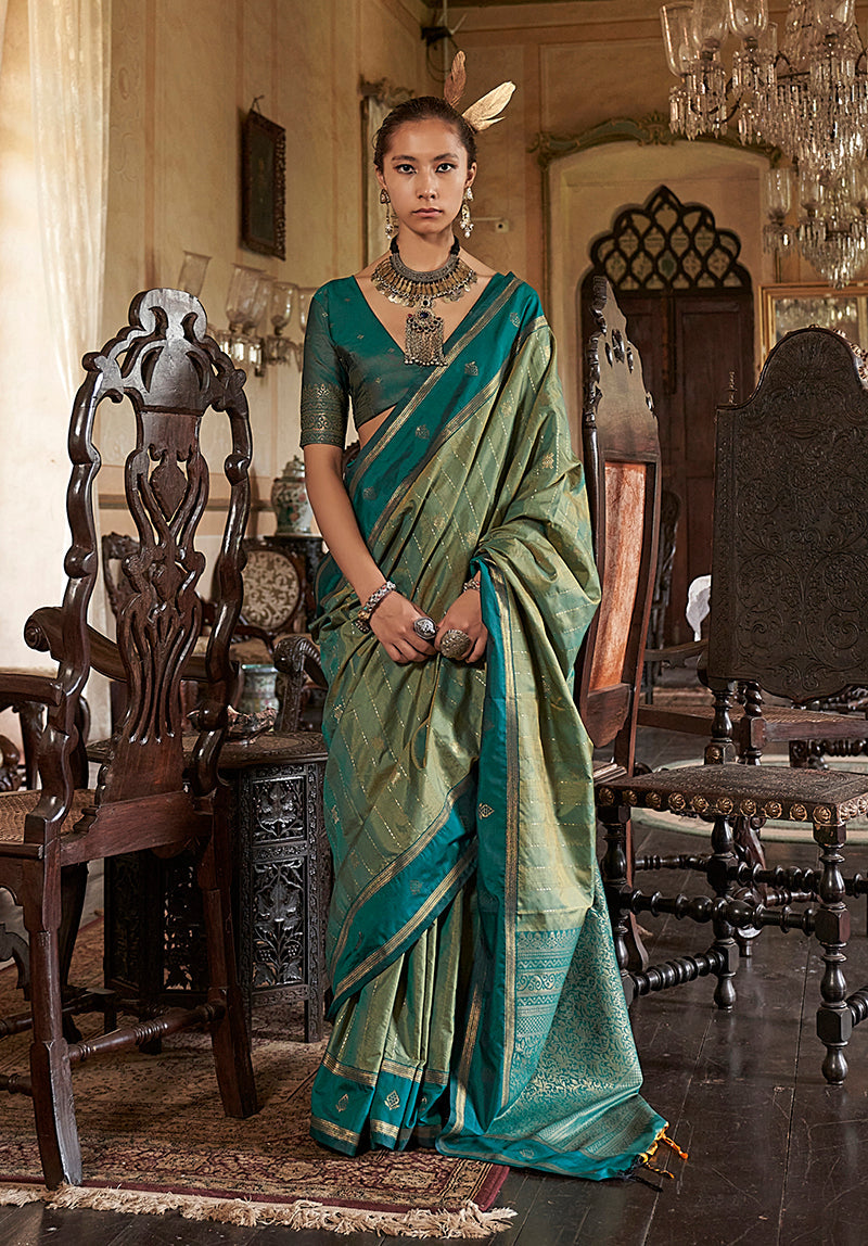 Sea green Tussar silk saree featuring elegant traditional weaving work