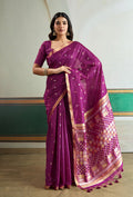 A luxurious purple handloom silk saree with detailed weaving, ideal for festivals.