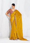 Mustard fancy fabric saree with intricate embroidery detail