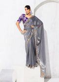 Grey fancy tissue embroidered saree for a refined party look