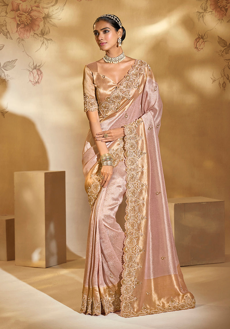 Light pink Ziraf silk saree with detailed Cut Dana and Moti embroidery.