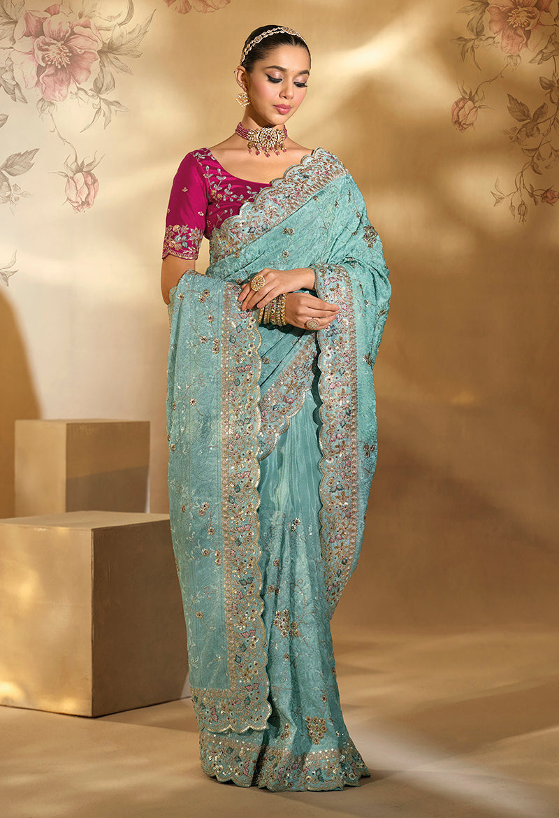 Sky blue Ziraf silk saree with intricate Cut Dana and Moti embroidery work and matching heavy blouse piece