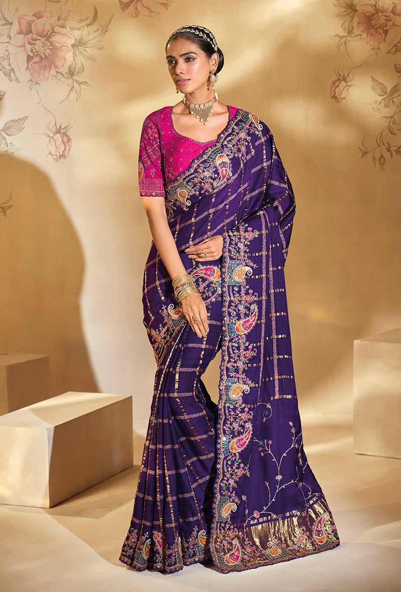 Purple Ziraf silk saree with detailed cut dana and moti embroidery plus a heavy work blouse.
