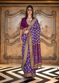 Purple silk blend saree with traditional double Ikkat patterns and subtle foil print work.