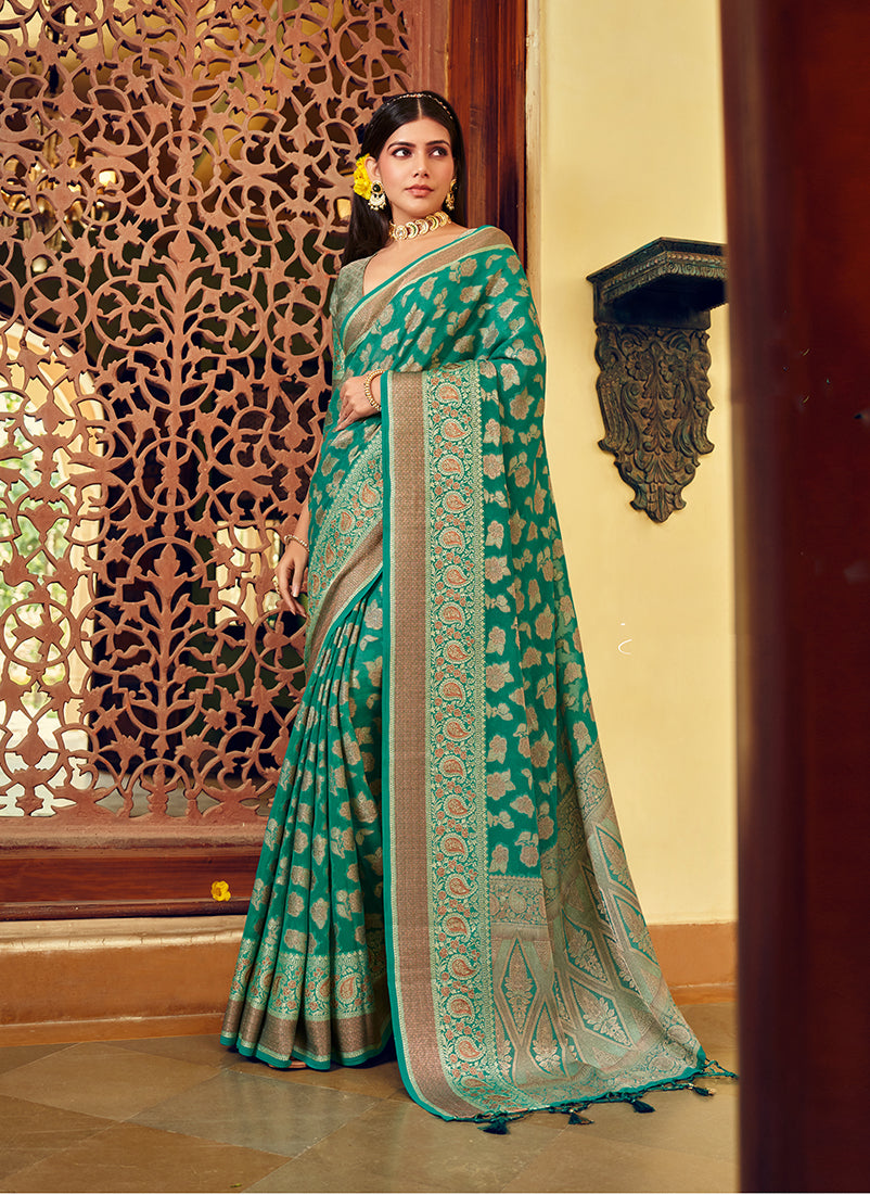 Classic turquoise georgette saree featuring a detailed weaving buta border.