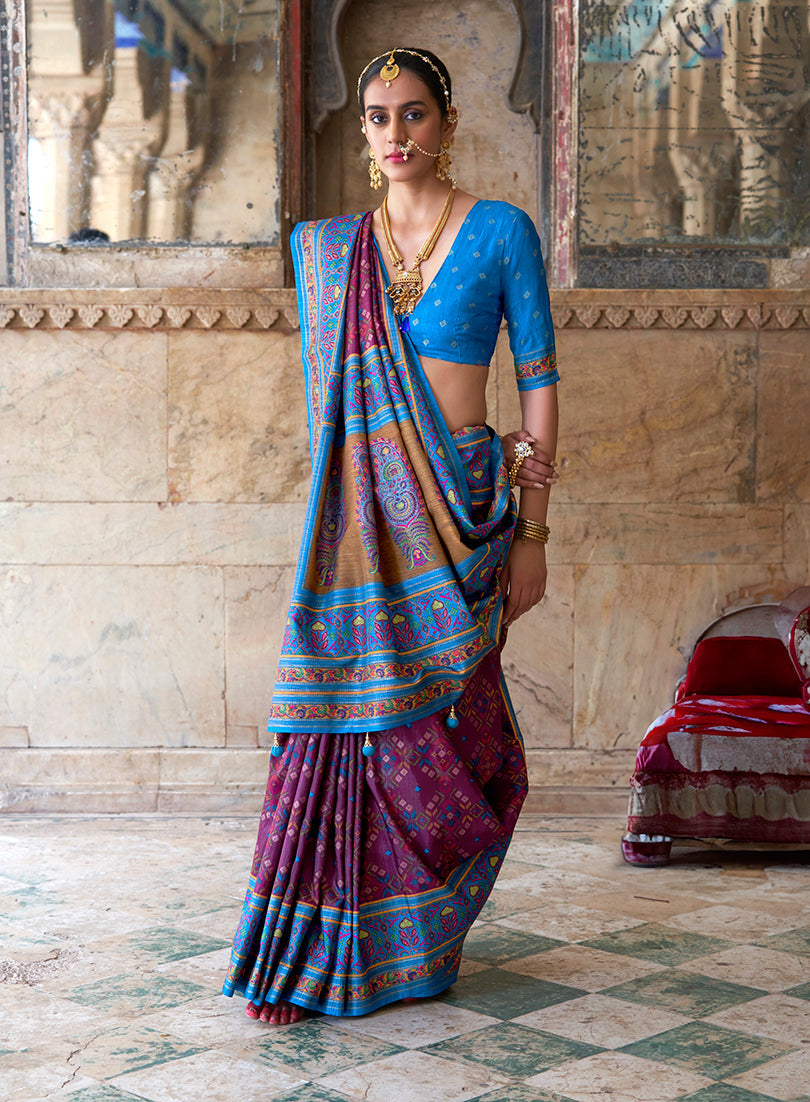 Purple and aqua blue silk blend saree featuring a traditional Patola print
