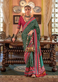 Dark Green silk blend saree with traditional Patola pattern and Zari embroidery
