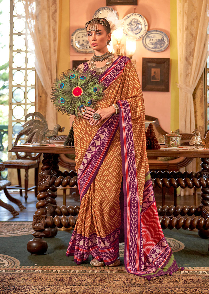 Mustard color saree with traditional Patola design and zari work